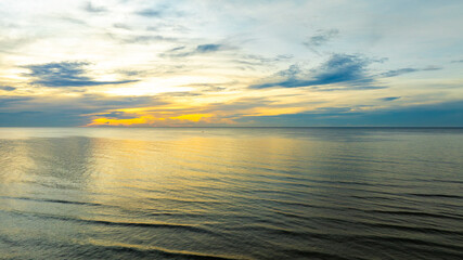 Nature sunset sky, the sun rises on the horizon, colorful sky at sea , nature concept background.	