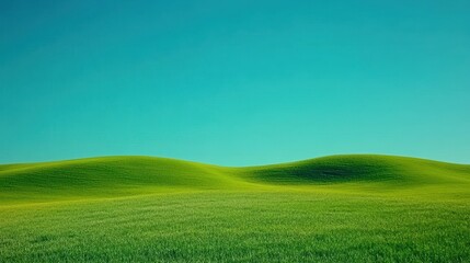 Obraz premium A serene landscape featuring rolling green hills under a clear blue sky, evoking tranquility and natural beauty.