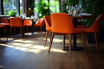 Fototapeta premium Modern restaurant interior with orange chairs. Perfect for showcasing upscale dining or hospitality.