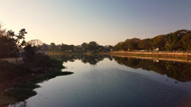Godavari river near Panchavati Hindu temple and Ganga Ghat in Nashik, Maharashtra, Drone shot