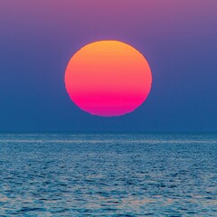 Vibrant Sunset Over Calm Ocean With Gradient Sky Colors