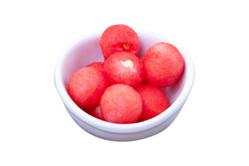 Watermelon balls in white ceramic bowl isolated on cut out PNG or transparent background. With melon baller freshly cut out spheres ready-to-eat pieces of red ripe and seedless fruit sweet.	