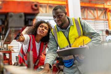 African workers working team happy aftter working of maintenance machine in heavy industrial factory