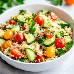 A vibrant and fresh quinoa salad with cherry tomatoes, cucumbers, and a lemon vinaigrette