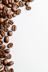 Naklejka premium Freshly roasted coffee beans scattered on a white background, showcasing rich textures and colors
