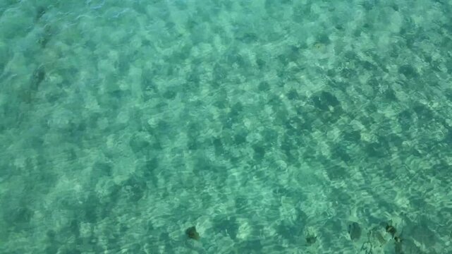 Experience the breathtaking turquoise waters of Cala Varques in Porto Cristo, Mallorca. Discover the vibrant marine life and beautiful rock formations beneath the surface.