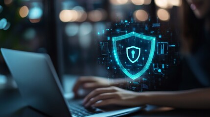 Cybersecurity awareness during remote work hours with digital shield on laptop screen
