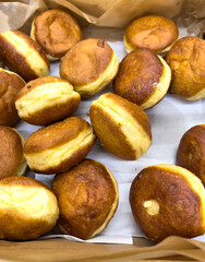 A box of doughnuts with a white background