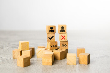 Obraz premium Pros and cons concept. Wooden block with image of pros versus cons. Tick mark and cross mark x on wooden cubes. Concept of YES or NO decision making