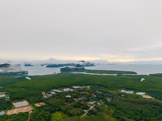 Landscape of Fishing village on Phang Nga bay. Aerial view Hong green lush tropical island, travel...