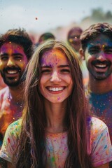 Fototapeta premium A joyous Holi festival celebration, with a smiling woman in a colorful crowd surrounded by flying colors.