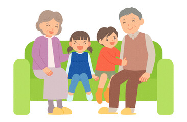笑顔でソファーに座る祖父母と孫