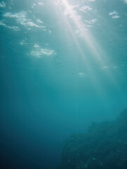 Fototapeta premium Sunlight streaming through tranquil underwater ocean scene