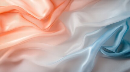 Fototapeta premium Close-up view of flowing satin fabric showcasing an iridescent surface that shifts from gold to silver while illuminated in a creative lighting setup