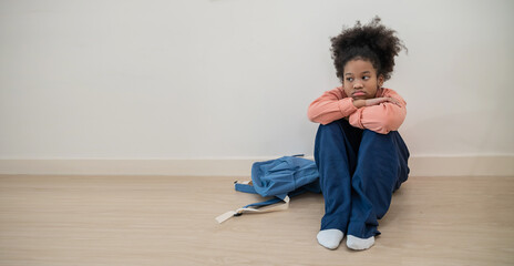 Lonely black little girl children sitting in corner of room. Homeless orphan stressful kids,...