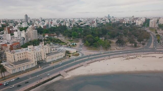 Panoramic aerial footage revealing coastline landscape of parque rodo and playa rami&shy;rez, showcasing urban scenery and natural beauty of montevideo's coastal district