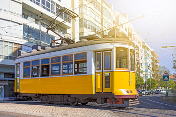 European Travel Ideas. Closeup of Outdated Retro Vintage Yellow Ancient Tram Tramway on Streets of Lisbon in Portugal