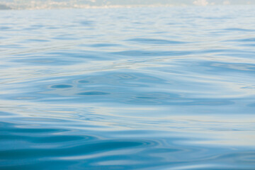 Naklejka premium Close-up of gentle ripples on the surface of Lake Geneva.