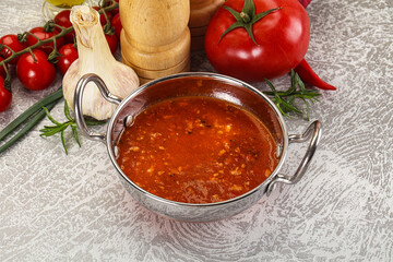 Hot tomato soup with diced chicken
