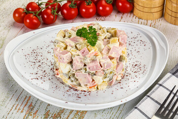 Russian traditional Olivier salad with sausages