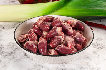 Raw chicken hearts in the bowl