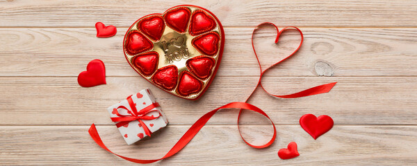 Delicious chocolate pralines in box for Valentine's Day. Heart shaped with gift box of chocolates...
