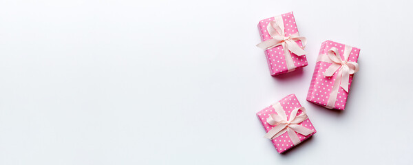 Valentine day composition: red gift box with bow and heart. Christmas present. View from above....
