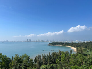 Bay and beach with the city Da Nang in the background