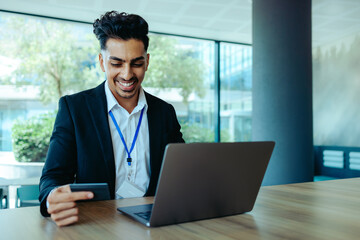 Fototapeta premium Business professional enjoying convenient online shopping in modern office