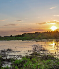 Lake with a sunset in the background