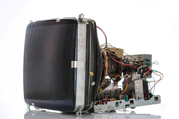 Old CRT monitor disassembled showing internal components and wiring