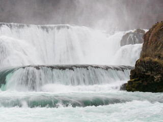 Waterfall on mountain river Una, mist rises from waterfall, National Park Una