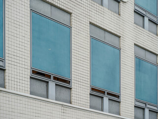 A collection of various exterior windows on buildings, showcasing diverse architectural styles and materials.