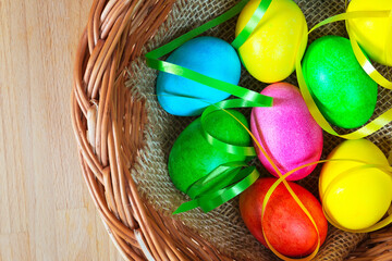 Colored decorated Easter eggs in basket