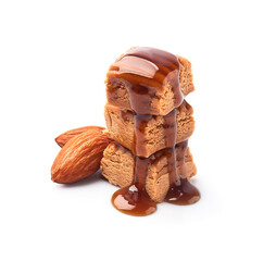 Caramel candy with liquid caramel topping and almonds nuts