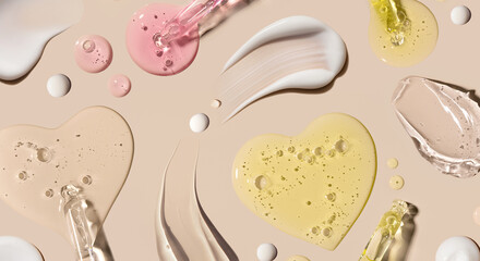 samples of cosmetic care products smear of cream texture on a beige background