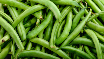 Detailed view of fresh green beans, emphasizing their smooth texture and bright green color. Perfect for healthy food, salads, or vegetable concepts. Texture, background.