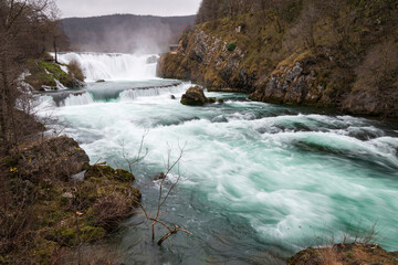 Waterfall and cascade on Una river, water sprays and flows in motion blur, turquoise colour