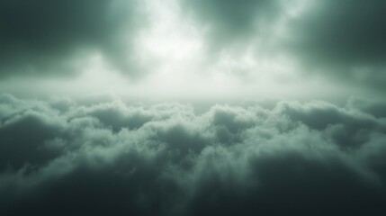 Obraz premium A dramatic view of dense, gray clouds under a moody sky, conveying an atmosphere of mystery and depth.