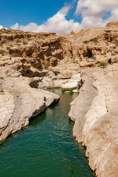 Scenic view of Wadi Bani Khalid in Oman with rocky formations and water