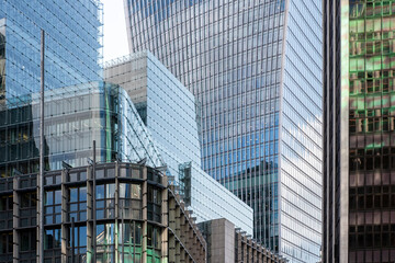 Urban perspective of contemporary office buildings in The City, London, emphasizing business growth, innovation, and global financial influence.