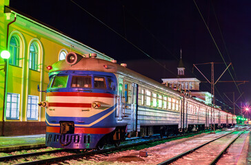 Old soviet electric commuter train on a winter night at Kovel station in Volyn Oblast of Ukraine