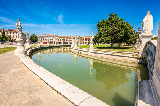 Prato della Valle in Padua, Veneto, Italy with statues and canal on a sunny day