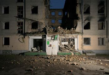 Damaged residential building after airstrikes in Borodyanke, Ukraine at night