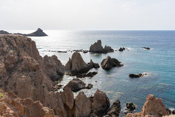 beautiful volvanic cliff on the sea coast, the mermaids in Spain