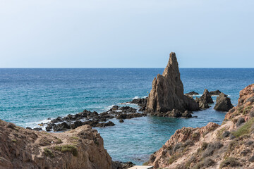 beautiful volvanic cliff on the sea coast, the mermaids in Spain