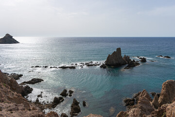 beautiful volvanic cliff on the sea coast, the mermaids in Spain