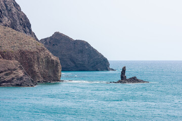 black volcanic cliffs on the Mediterranean coast