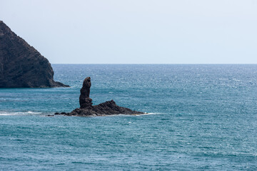 black volcanic cliffs on the Mediterranean coast