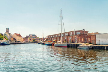 Old port with fishing and sailing boats in Wismar, Germany
